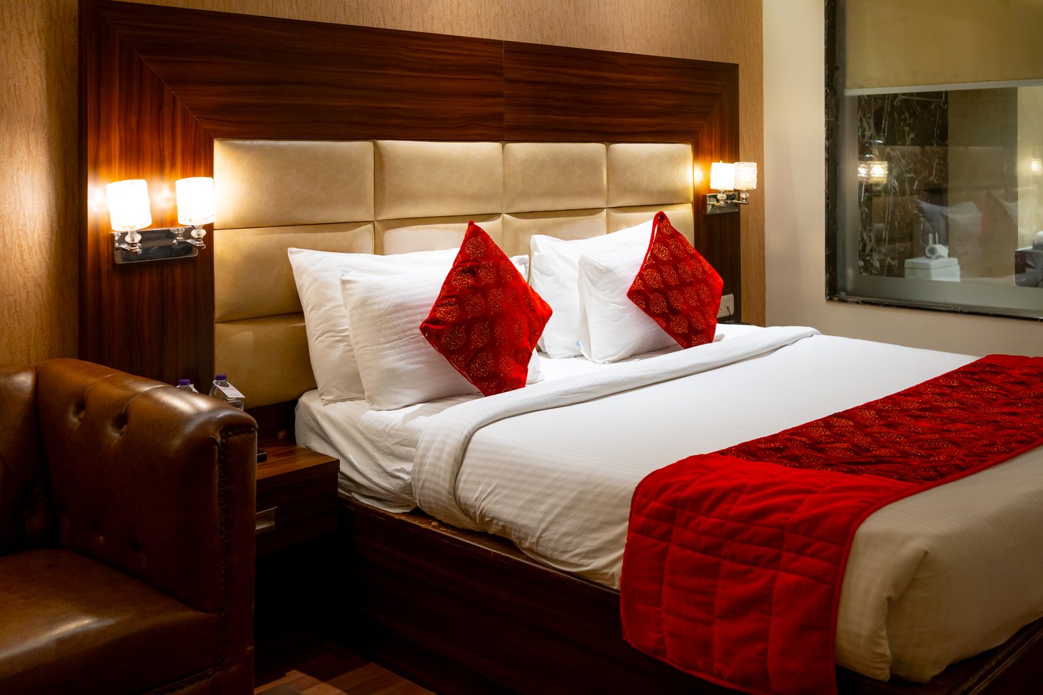An Executive Room, the king bed with its leather sofa alongside