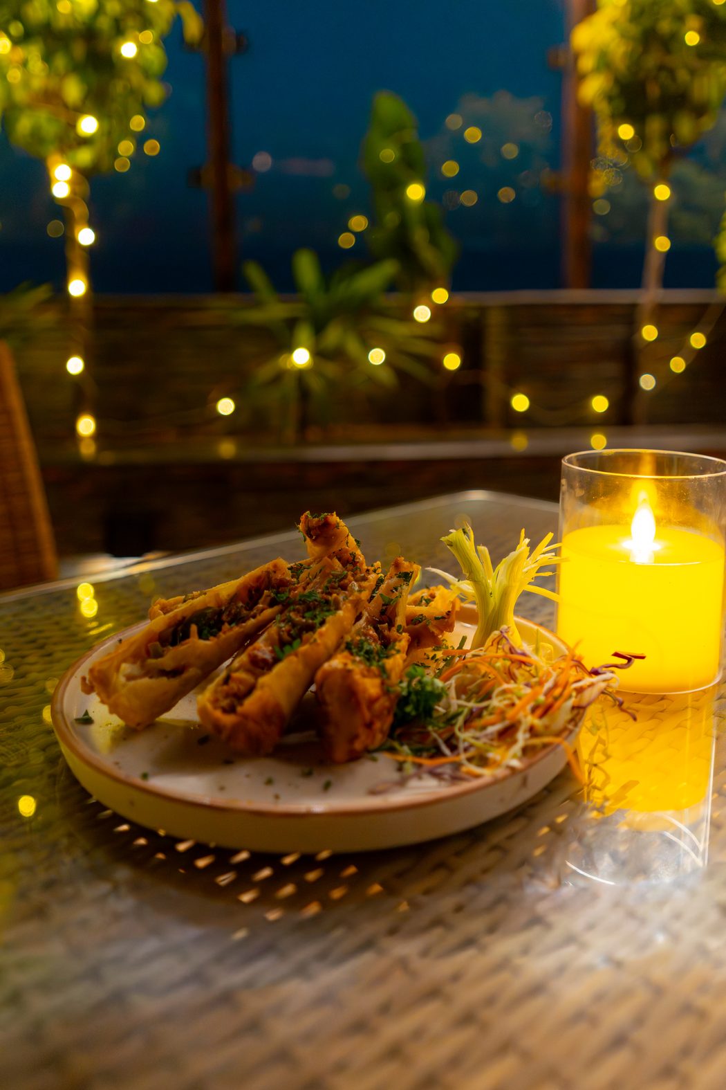 A starter plated on the board, beside the candle