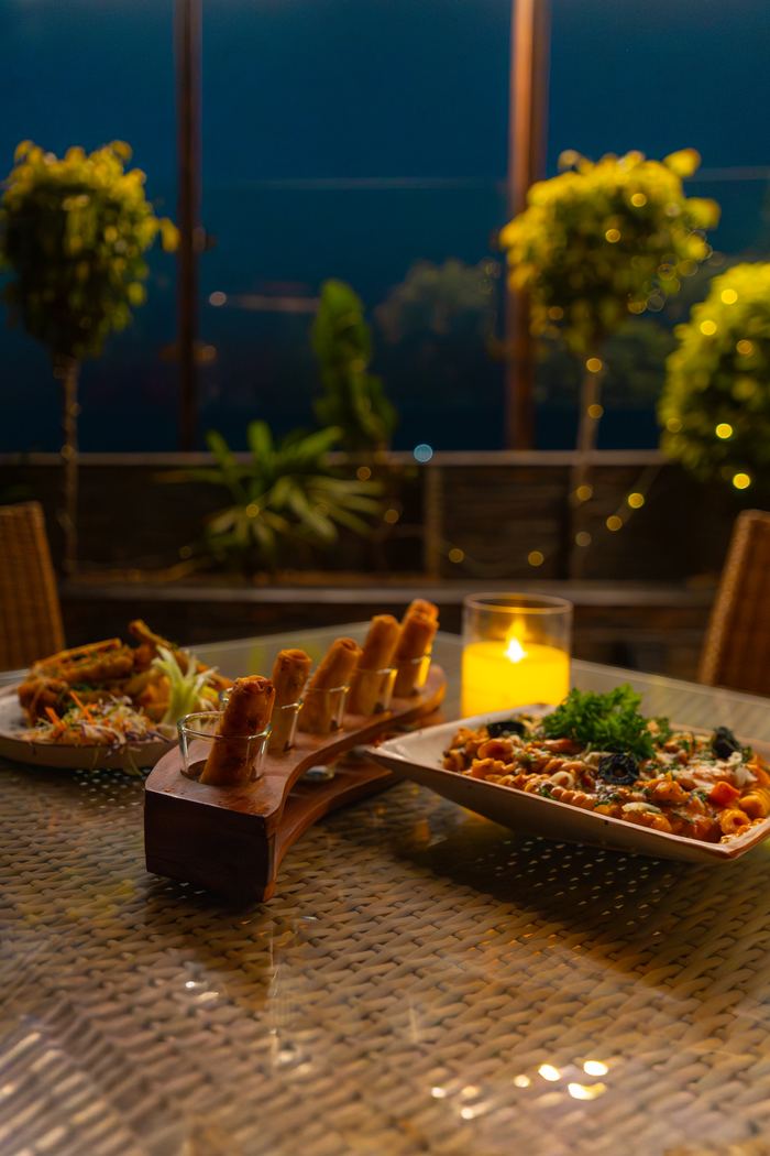 A terrace table laid at dusk