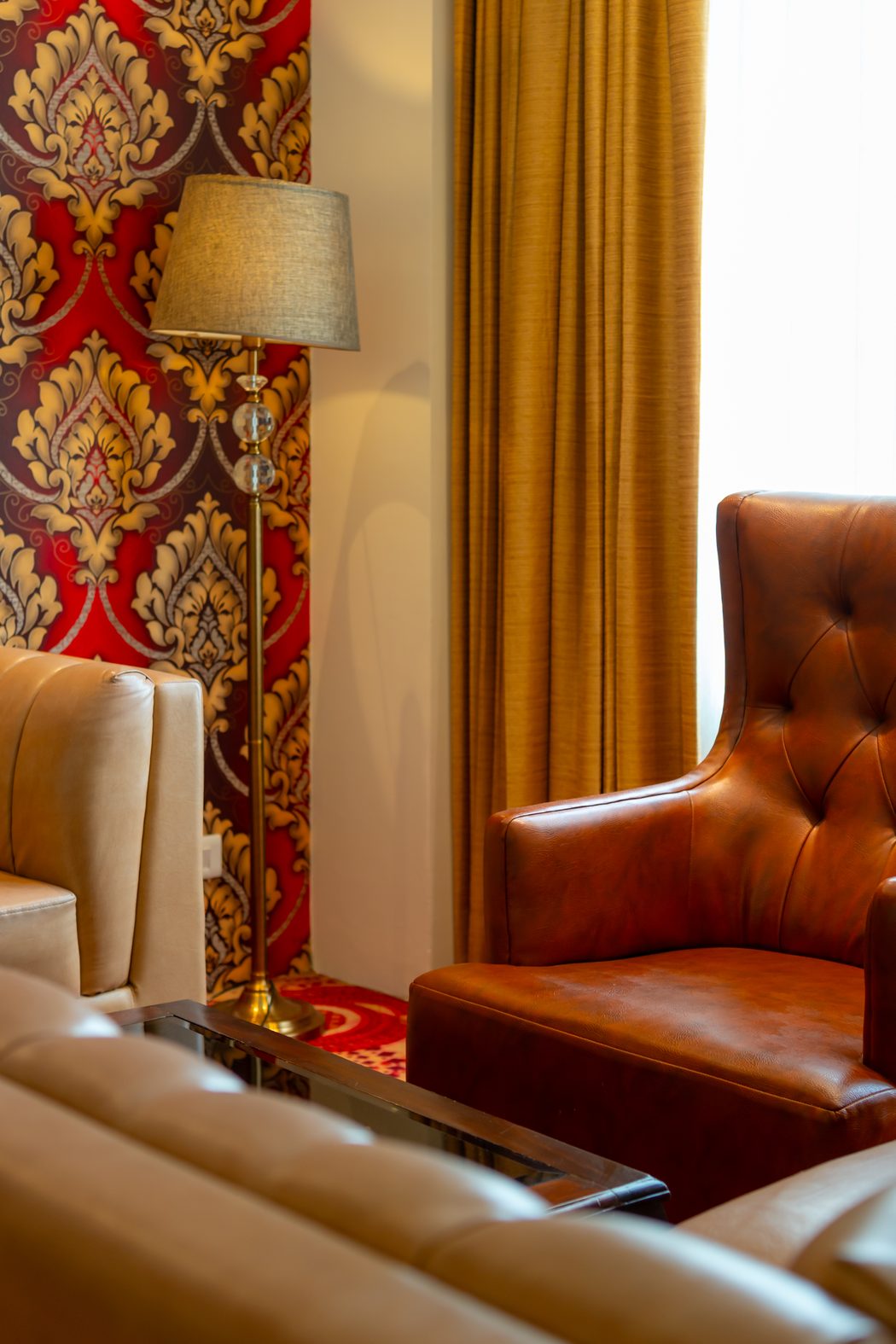 A corner of the Suite's sitting room, damask paper and leather