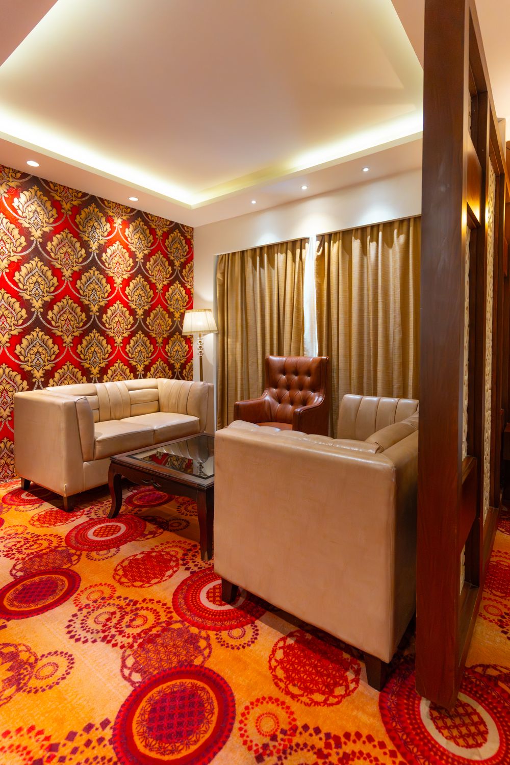 Suite: The Suite's own sitting room, sofas on the patterned carpet