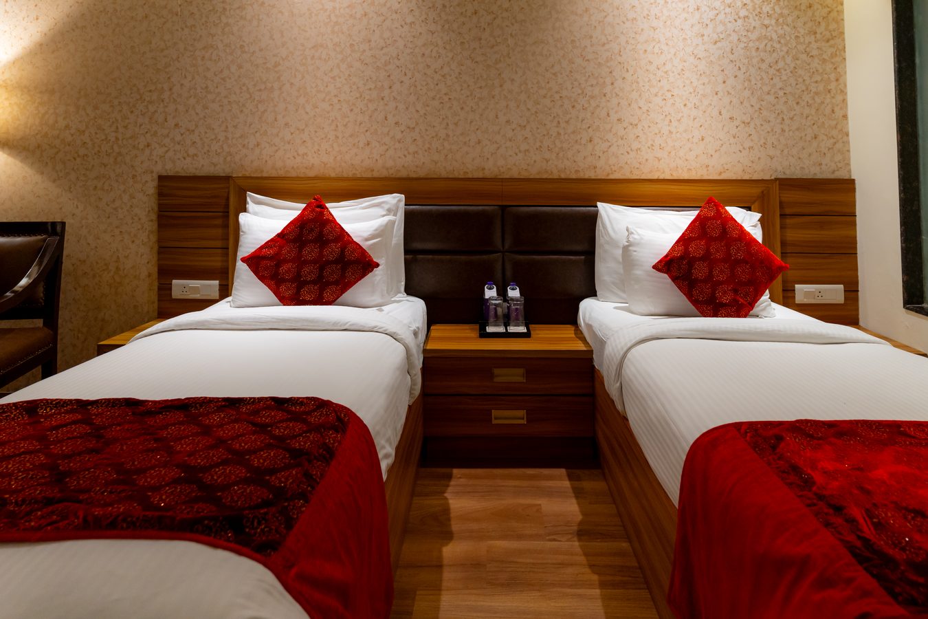 A Twin Room, both beds under the wooden headboard